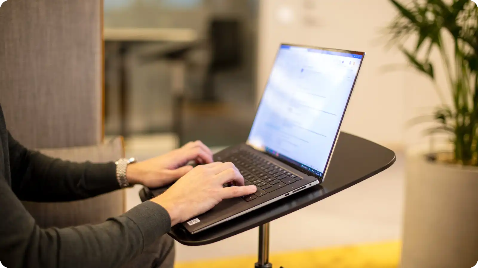 A person typing on a laptop.