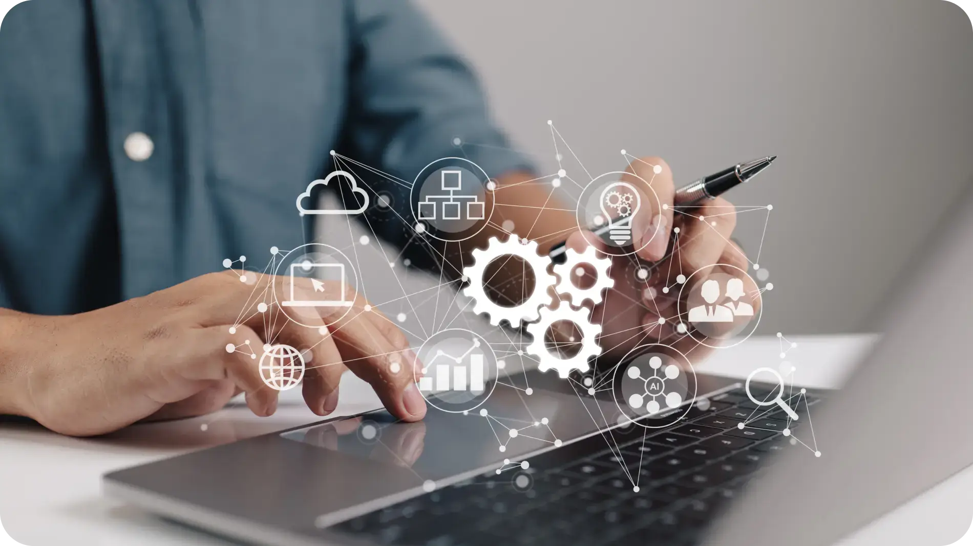Man sitting in front of laptop typing, illustrating automation.